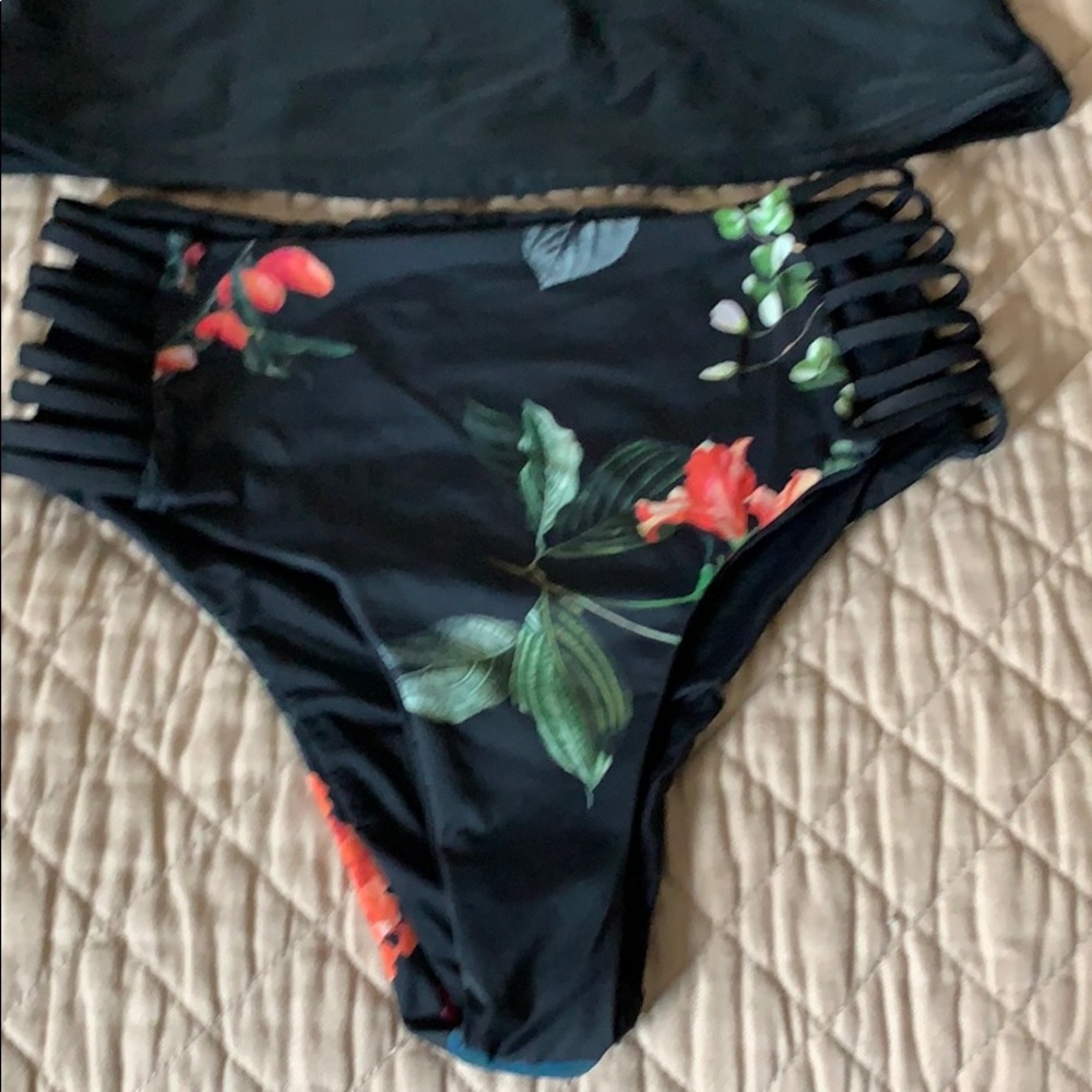 Black tankini with reversible bottom.